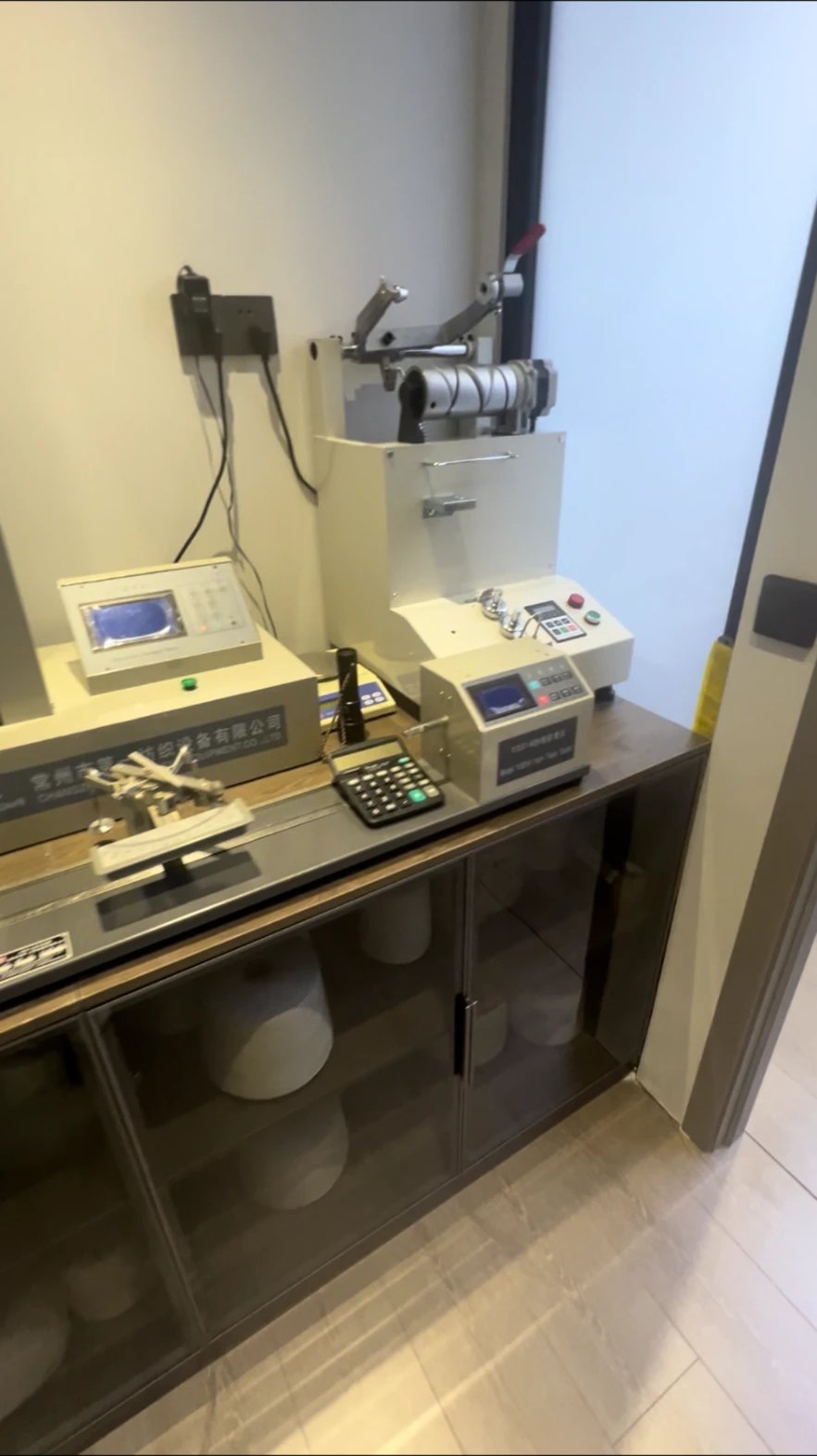Textile laboratory testing equipment on a counter