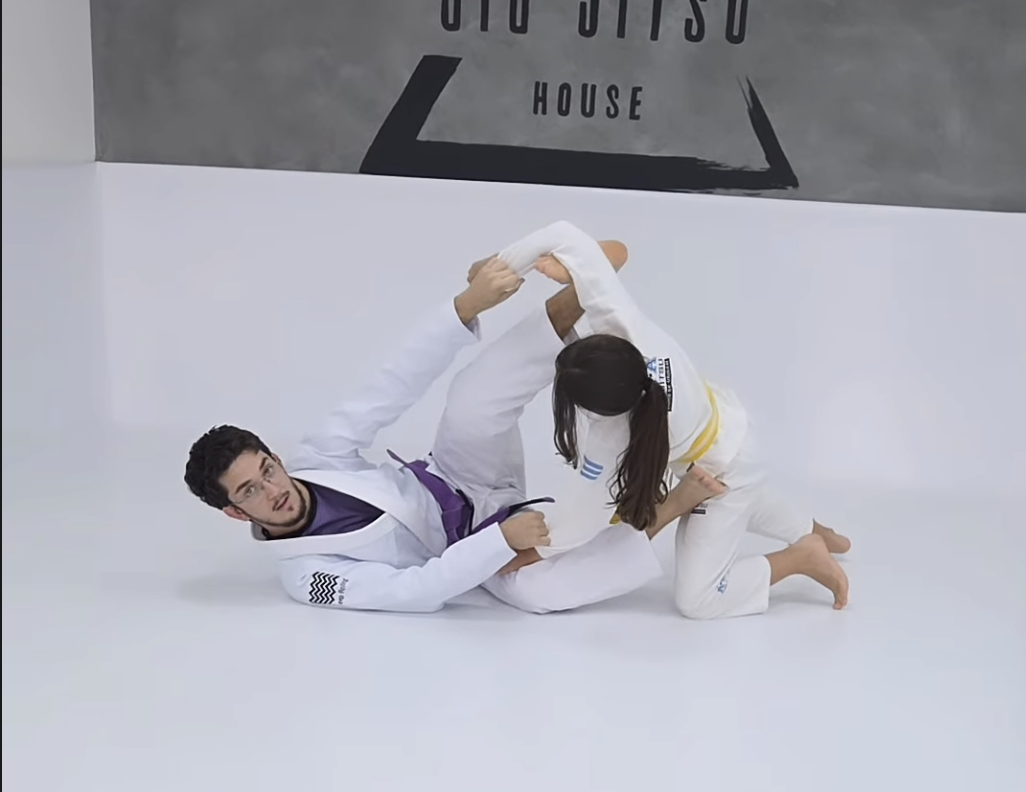 Gustavo training with a kid in gis