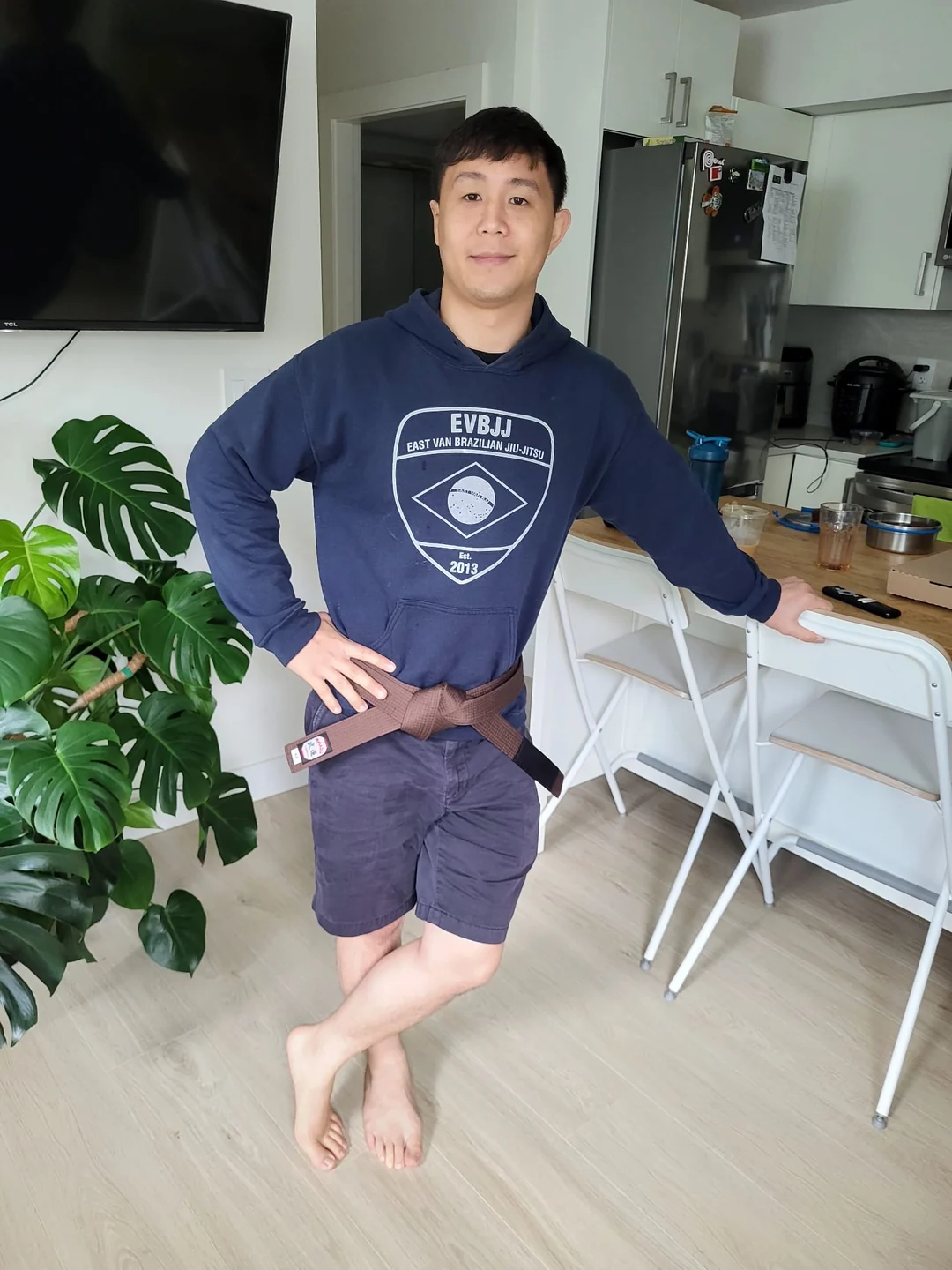 Mike Lim wearing a jiu-jitsu belt and hoodie
